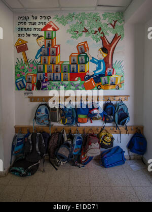 (140601) -- JERUSALEM, June 1, 2014 (Xinhua) -- Orthodox Jewish pupils' bags are seen outside a classroom of Torat Moshe elementary school in Beit Shemesh, about 20 km from Jerusalem, on May 29, 2014. Tzviel Noyman is an Israeli Ultra-Orthodox boy in a family with six children, three boys and three girls. He is ten years old this year and a grade three pupil of Torat Moshe elementary school, which is only opened to Jewish children. Tzviel has eight classes each day, including Hebrew, English, mathematics and Jewish religion, which has four classes each day including Talmud, Mishnah and Gemara. Stock Photo