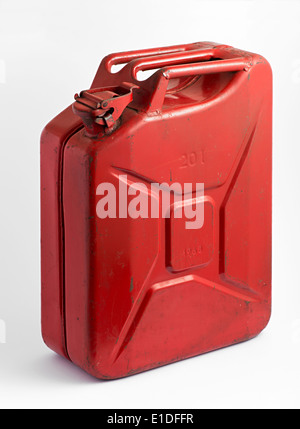 Red metal fuel tank or jerry can for transporting and storing gasoline or diesel fuel on a white background Stock Photo
