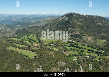 AERIAL VIEW. Monte-Carlo golf course (800m above the Principality of Monaco), below Mont Agel (1148m) and with the Mercantour Alps on the horizon. Stock Photo