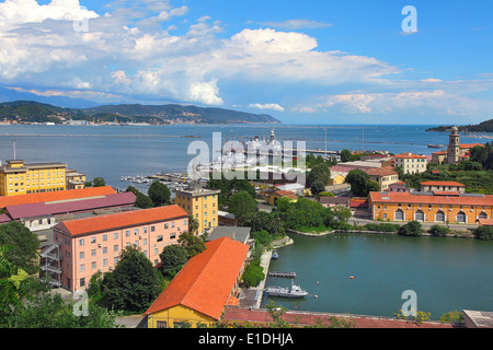 View of navy base on gulf of La Spezia under beautiful blue sky with white clouds on Mediterranean sea in Italy. Stock Photo