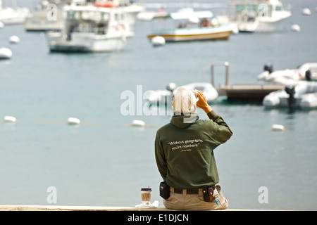 'Without Geography, You're Going Nowhere' Senior Man Drinks Coffee On The Waterfront In Avalon, Catalina Island, California. Stock Photo