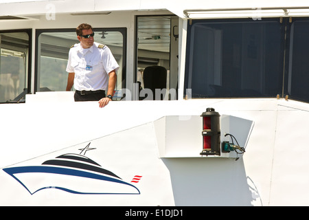 Captain Of The Catalina Express SeaCat 'Catalina Jet' On The Bridge, Departing for Long Beach, California. Stock Photo