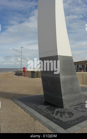 Blue sky white clouds portrait, looking north, grey base with inscriptions, 'Sea Swallow Sculpture, Cleveleys Promenade, UK Stock Photo