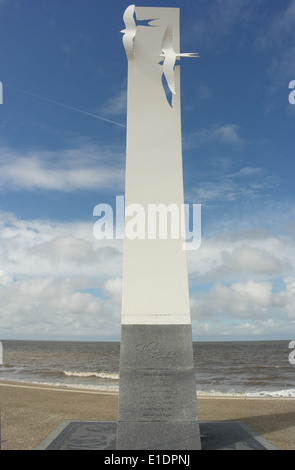 Blue sky white clouds portrait, towards high tide Irish Sea waves, 'Sea Swallow Sculpture', Cleveleys Promenade, Fylde Coast, UK Stock Photo