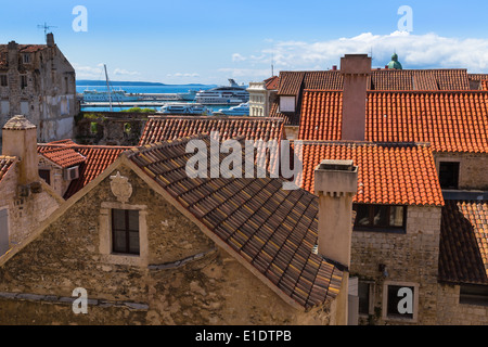 looking across the distinctive orange rooftops of split town towards the island of Brac from diocletian's palace Stock Photo