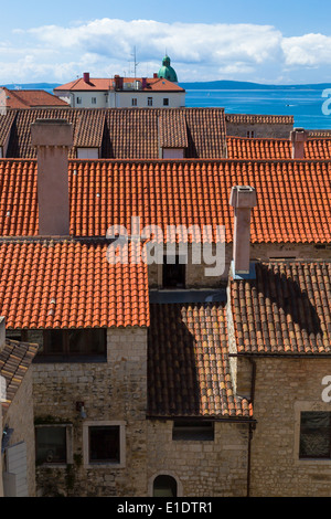 looking across the distinctive orange rooftops of split town towards the island of Brac from diocletian's palace Stock Photo