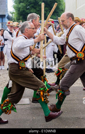 Ashdown Forest Morris men dancing in the courtyard of the Bell Inn Great Bardfield Essex UK on 31st May 2014 as part of the Morris ring festival.  Morris dancing is an English type of folk dancing. The dancers are participating in a festival called the morris ring which has been held in Thaxted annually since 1934 Stock Photo