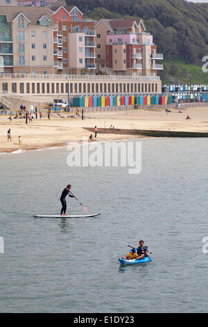 Paddleboarding and kayaking at Boscombe beach with The Overstrand in the distance in June. Credit:  Carolyn Jenkins/Alamy Live News