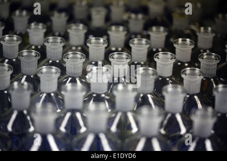 wide shot of glass bottles tops with ground glass necks in a lab Stock Photo