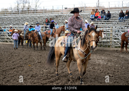 high school rodeo competitor takes his position in calf roping. Stock Photo