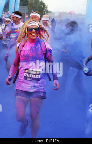 London, UK. 1st June 2014. Participants in the London Color Run, Wembley Park, London. The Color Run is a five-kilometre, un-timed race in which thousands of participants are doused from head to toe in different colours at each kilometre. Colour and fun for everyone. Known as the Happiest 5K on the planet. Credit:  Paul Brown/Alamy Live News Stock Photo