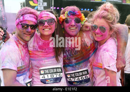London, UK. 1st June 2014. Participants in the London Color Run, Wembley Park, London. The Color Run is a five-kilometre, un-timed race in which thousands of participants are doused from head to toe in different colours at each kilometre. Colour and fun for everyone. Known as the Happiest 5K on the planet. Credit:  Paul Brown/Alamy Live News Stock Photo
