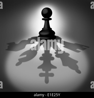 Team leader business concept as a chess pawn piece casting a shadow with a company group consisting of a king queen knight bisho Stock Photo
