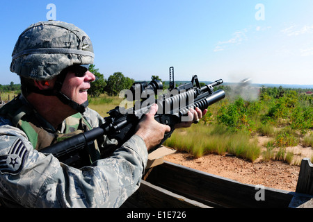 U.S. Air Force Staff Sgt. Patrick Murphy fires an M-203 grenade launcher during annual heavy weapons training at Bastogne Range Stock Photo