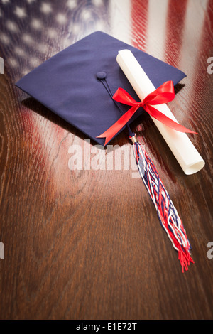 Graduation Cap And Diploma On Table With Books Stock Photo - Alamy