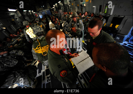 U.S. Air Force Globemaster III crew members, with the 535th Airlift Squadron from Hickam Air Force Base (AFB), H.I., review saf Stock Photo