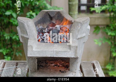 Fire burning charcoal in asian stove , for bbq Stock Photo