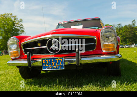 Old Westbury, New York, USA. 01st June, 2014. A red 1969 Mercedes Benz, owned by Leonard J Hummel, is an entry at the Antique and Collectible Auto Show held on the historic grounds of elegant Old Westbury Gardens in Long Island, and sponsored by Greater New York Region AACA Antique Automobile Club of America. Credit:  Ann E Parry/Alamy Live News Stock Photo