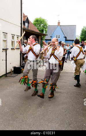 Ashdown Forest morris men from Sussex at the Bell Inn Gt. Bardfield Essex, UK on the 31st May 2014.  Morris dancing is an English folk dance carried out by men in special costumes.  The dancers were participating in a festival called the morris ring which has been held in Thaxted annually since 1934 Stock Photo