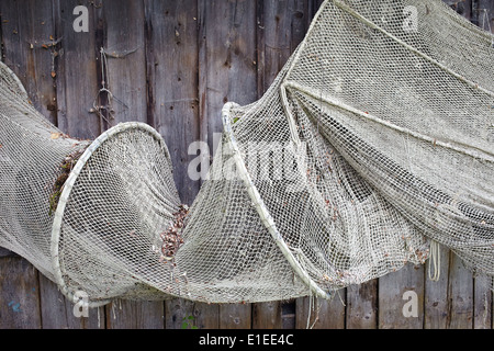 Old fishing nets hanging at wooden barn wall in Dießen, Ammersee
