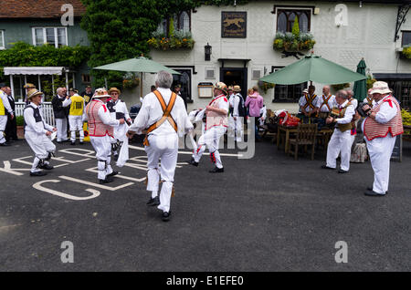 Morris men dancing at the Fox Inn Finchingfield   Essex, UK on 31st May 2014.  Morris dancing is an English folk dance performed by men in costume.  The dancers are participating in a festival called the morris ring which has been held annually in Thaxted since 1934 Stock Photo