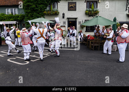 Morris men dancing at the Fox Inn Finchingfield   Essex, UK on 31st May 2014.  Morris dancing is an English folk dance performed by men in costume.  The dancers are participating in a festival called the morris ring which has been held annually in Thaxted since 1934 Stock Photo