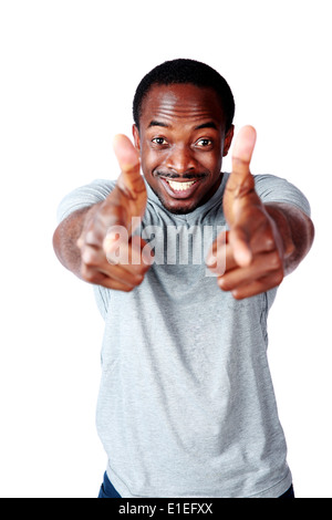 Happy african man with two hands guns sign gesture pointing at you Stock Photo