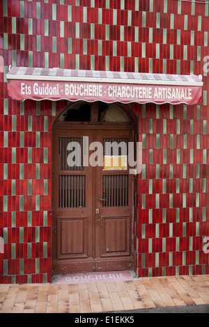 A butcher located in a small side street in Calenzana, Corsica. Stock Photo