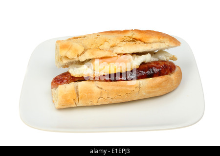 Fried egg and sausage baguette on a plate isolated against white Stock Photo