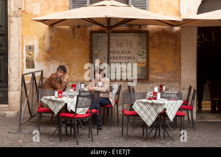 Rome cafe - a local middle aged couple having a morning cup of coffee  outside, Rome, Italy Europe Stock Photo