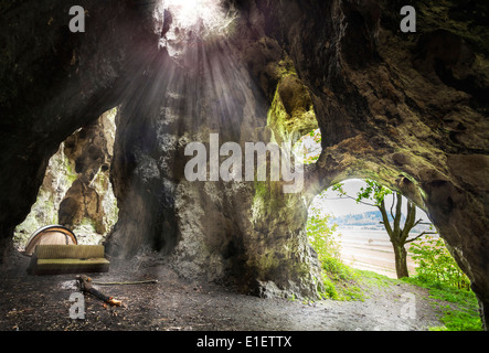 Interesting cave with sofa, tent and fire place, mountains in Poland, Jura. Stock Photo