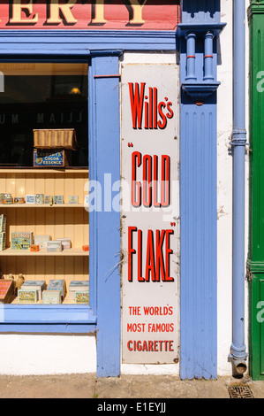 Old fashioned sign for 'Willis's Gold Flake' cigarettes outside a shop Stock Photo