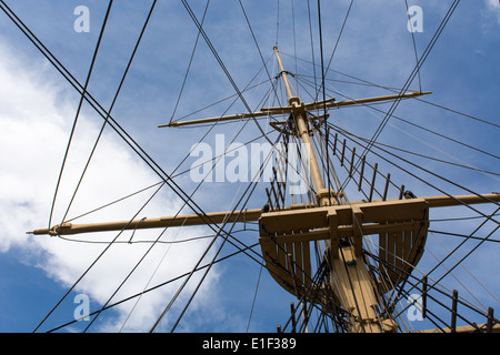 Mast and rigging of a big old sailing ship in front of a blue sky Stock Photo