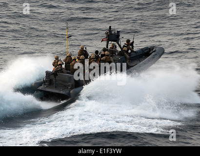 U.S. Marines assigned to the 15th Marine Expeditionary Unit?s Maritime Raid Force approach the motor vessel Magellan Star in th Stock Photo