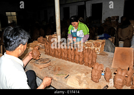 Terracotta Warrior souvenirs being made in factory by artist Xi'an China Stock Photo