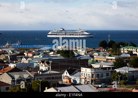 looking down over the city from la cruz viewpoint towards large cruise ship in Punta Arenas Chile Stock Photo