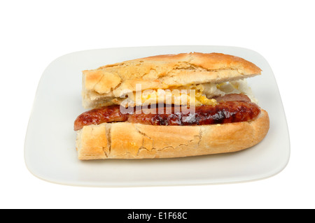 Fried egg and sausage baguette on a plate isolated against white Stock Photo