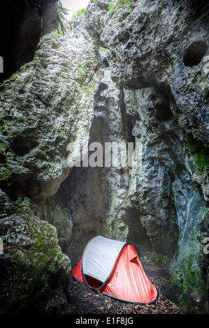 Tent in cave, extreme camping for climbers, Jura, Poland Stock Photo