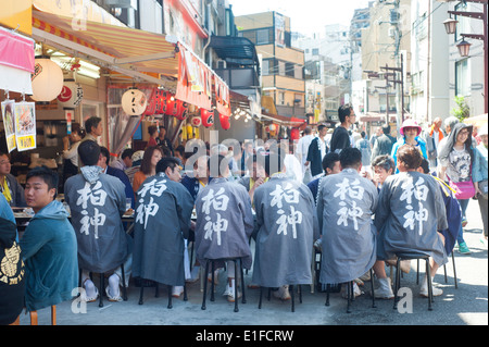 Tokyo Japan - Street scene with people eating outside during a sanja matsuri Stock Photo