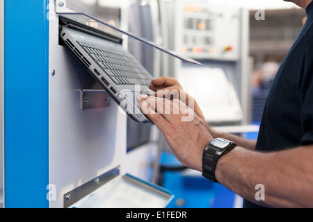 man working at programmable machine Stock Photo
