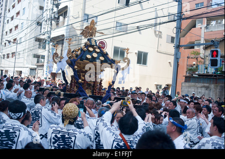 Tokyo, Japan - May 2014 - People attend to see carrying portable Shinto Temples (Mikoshi) during the Sanja Matsuri in Asakusa Stock Photo