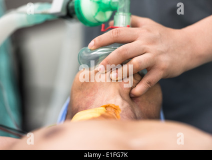 Hold Mask O2 hold oxygen mask Stock Photo - Alamy
