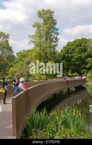 The Sackler Crossing bridge over the lake in Kew Gardens. Stock Photo