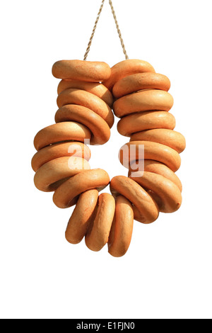 Bagels with rope on white background Stock Photo