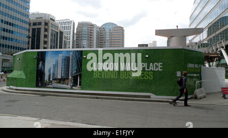 London, UK. 2nd June 2014. A view of London Wall Place sign on construction site hoarding.  Two new office buildings and public spaces near Moorgate Station will be set amidst Roman City Wall and St Alphage Church Tower remains historic monuments. The site was purchased by global developers Brookfield Office Properties and Oxford Properties.  The architect is Make. Credit: Kathy deWitt/Alamy Live News Stock Photo