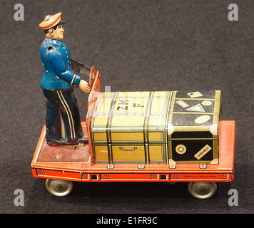 Tin toy suitcase trolley, Stock Photo