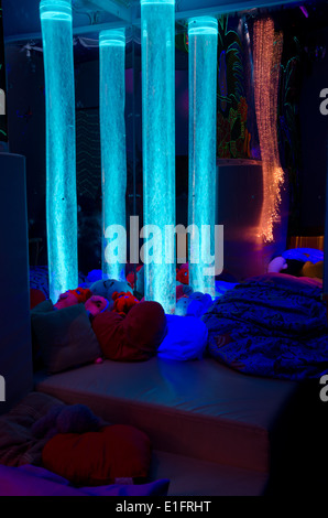 Bubble towers and fibre optic lighting in a disability charity sensory room - blue (1/4) Stock Photo