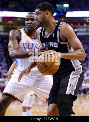 May 31, 2014 - Oklahoma City, OKLAHOMA, USA - San Antonio Spurs' Tim Duncan looks for room around Oklahoma City Thunder's Kendrick Perkins during first half action in Game 6 of the Western Conference finals Saturday May 31, 2014 at Chesapeake Energy Arena in Oklahoma City, OK. (Credit Image: © San Antonio Express-News/ZUMAPRESS.com) Stock Photo