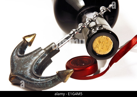 Opening red wine bottle with a corkscrew Stock Photo