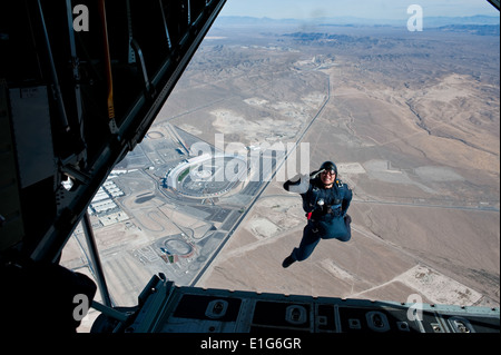 U.S. Air Force Academy Cadet 1st Class Alan Wong, with the academy?s parachute team, Wings of Blue, salutes as he exits the bac Stock Photo